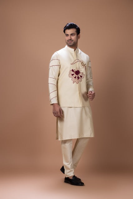 Beidge Pleated In Hand Stylish Kurta With Hand Flowerand Brnach Embroidery On Bundi Jacket With Pajama Set