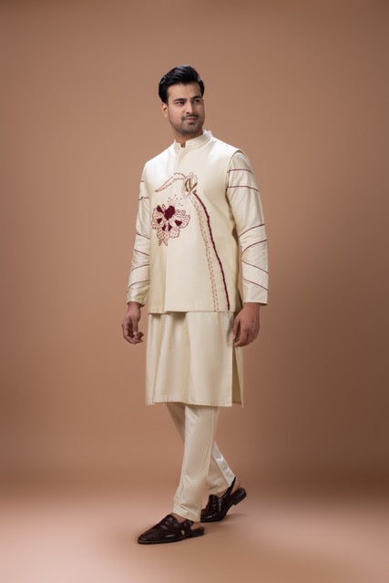 Beidge Pleated In Hand Stylish Kurta With Hand Flowerand Brnach Embroidery On Bundi Jacket With Pajama Set