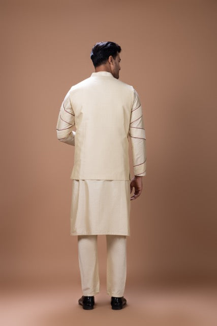 Beidge Pleated In Hand Stylish Kurta With Hand Flowerand Brnach Embroidery On Bundi Jacket With Pajama Set