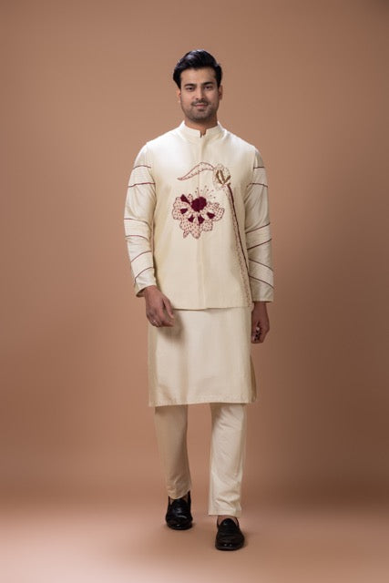 Beidge Pleated In Hand Stylish Kurta With Hand Flowerand Brnach Embroidery On Bundi Jacket With Pajama Set