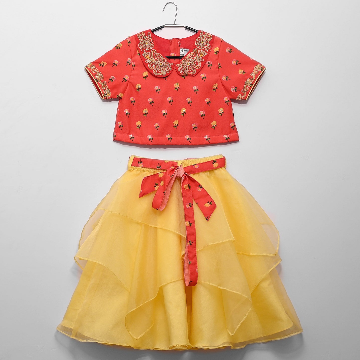 Red Printed Blouse/ Pan Embroidered Collar And Asyamartrical Yellow Ghagara With Printed Belt